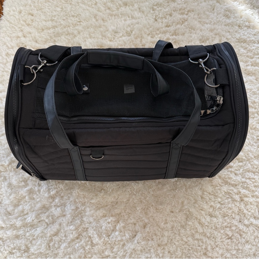 Used black soft pet carrier without interior padding